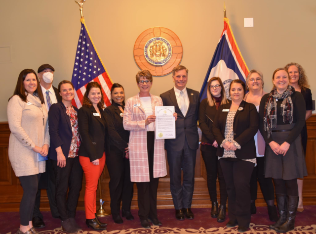 Wyoming 211 staff pictured with current Wyoming Governor Mark Gordon