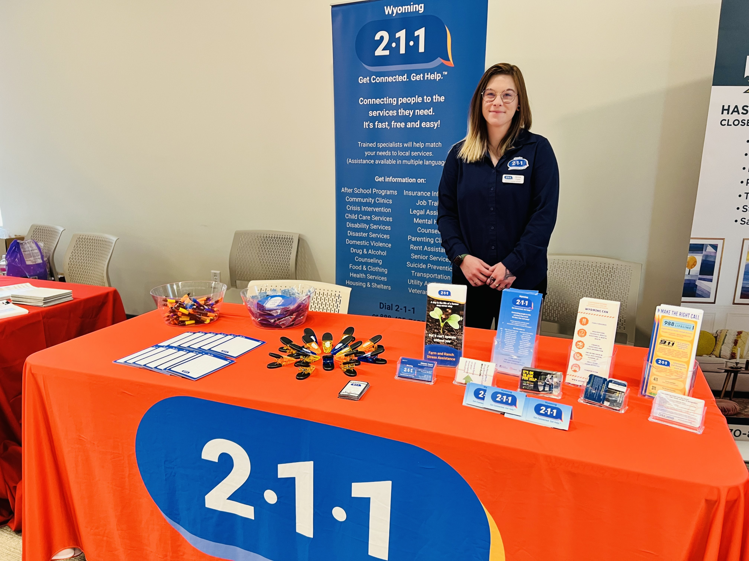 Nichole Coyne hosting a Wyoming 211 information booth
